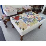 Two similar late 19thC circular footstools with tapestry upholstered tops;