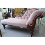 A late Victorian mahogany showwood framed chaise longue,