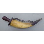 A late 19thC North European rough cut huntsman's' powder horn with metal and rivetted wooden mounts,