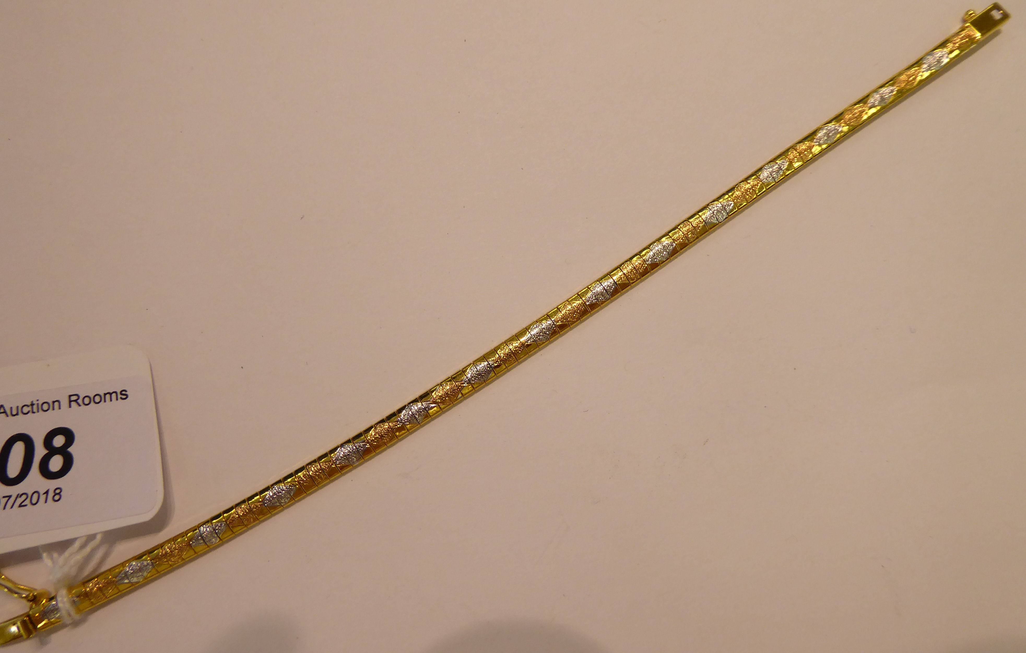 A 9ct gold tri-coloured gold flexible link bracelet,