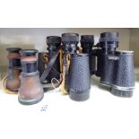 Three similar pairs of early 20thC binoculars: to include Charles Frank 8x30 OS1