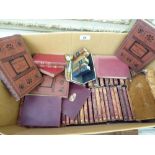 Books - miniature hide bound Charles Dickens stories;