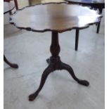 A 1930s Georgian style tip-top pedestal table with a thumb moulded piecrust border,