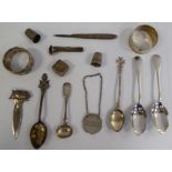 Small silver items: to include two napkin rings; a whisky decanter table,