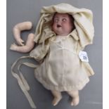 An early 20thC Bavarian bisque head doll with painted features,