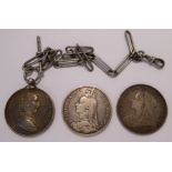 Two Victorian crowns 1890 and 1896, the latter with an inscribed rim; and a silver medallion,