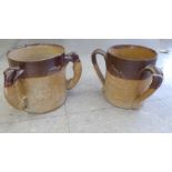 Two similar mid/late 19thC two tone, brown glazed stoneware, triple handled,