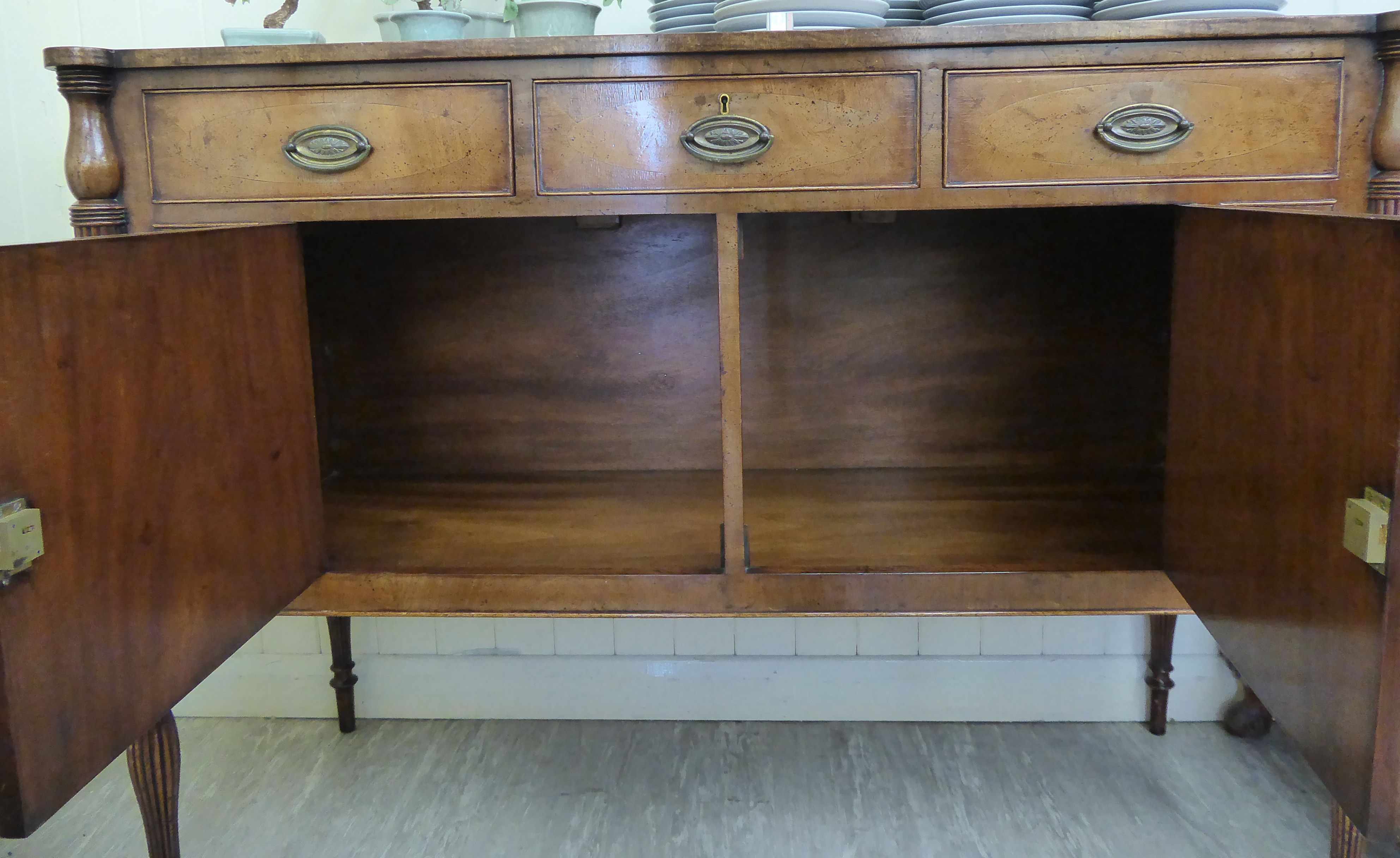 A Maple reproduction of a George III crossbanded mahogany sideboard with three frieze drawers, - Image 2 of 2