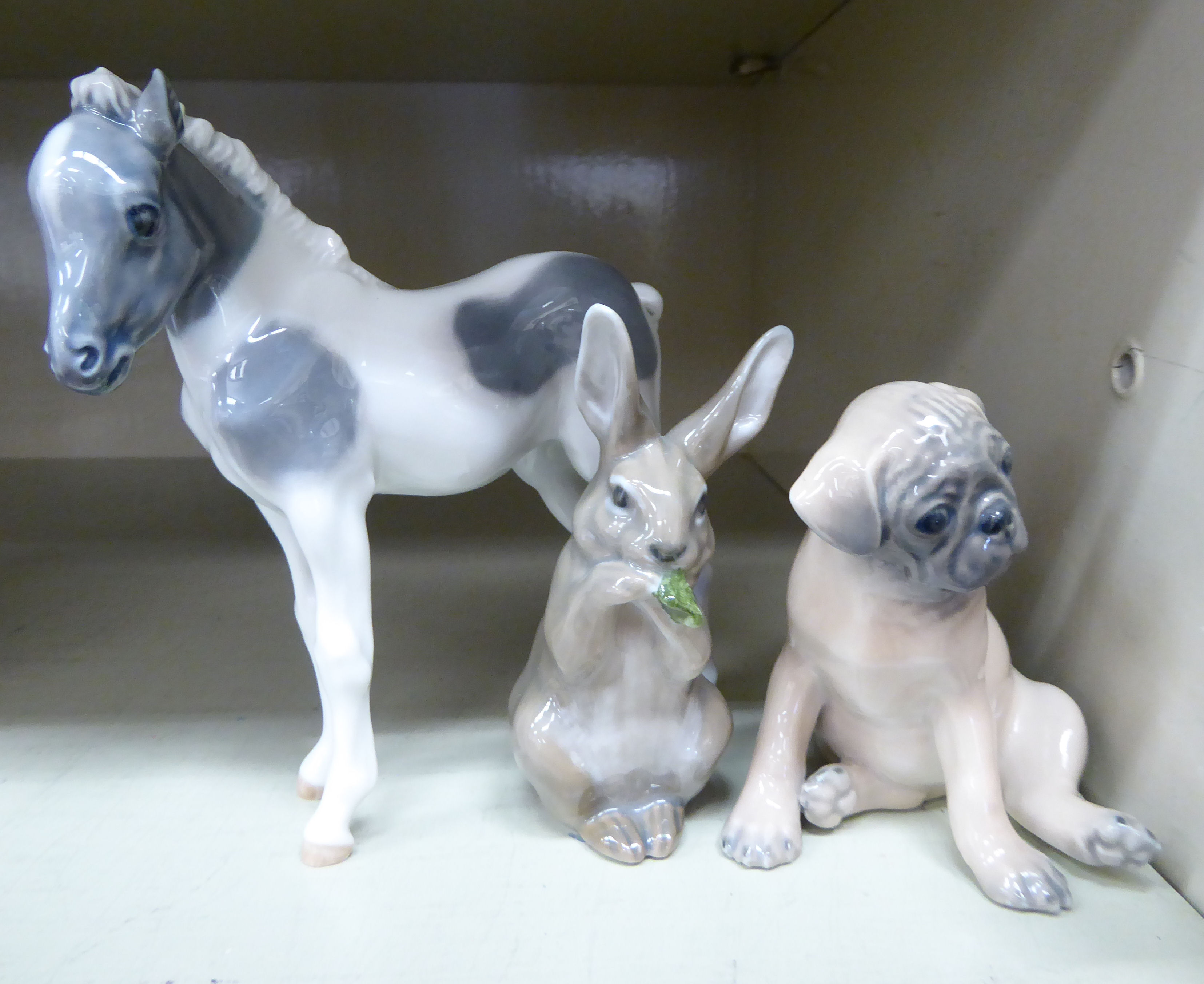 Three Royal Copenhagen porcelain models, viz. a boxer dog puppy no.