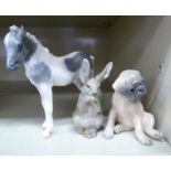 Three Royal Copenhagen porcelain models, viz. a boxer dog puppy no.