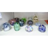 Twelve dissimilar glass paperweights: to include a Millefiori example OS10