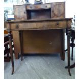 A modern 19thC style satinwood string inlaid mahogany finished bonheur du jour with a shelved,