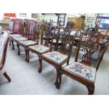 A set of six modern Chippendale style mahogany framed dining chairs with ribbon carved splats,