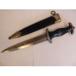 A replica SS dagger, the carved, ebonised wooden handgrip moulded with emblems, the 8.