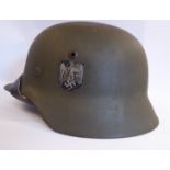 A World War II German Army steel helmet,