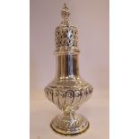A Georgian style silver caster of wrythen moulded and fluted pedestal vase design,