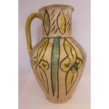 A 9th/10thC Amol naively decorated tri-coloured pottery jug of shouldered,