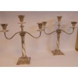 A pair of early 20thC silver plated two-part, triple table candelabra,