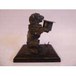 A mid 19thC cast and chased silver novelty inkwell, a begging spaniel with a top hat,