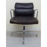 A 'vintage' Herman Miller chromium plated framed desk chair with open arms and a stitched hide,