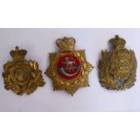 Three military helmet badges, viz.