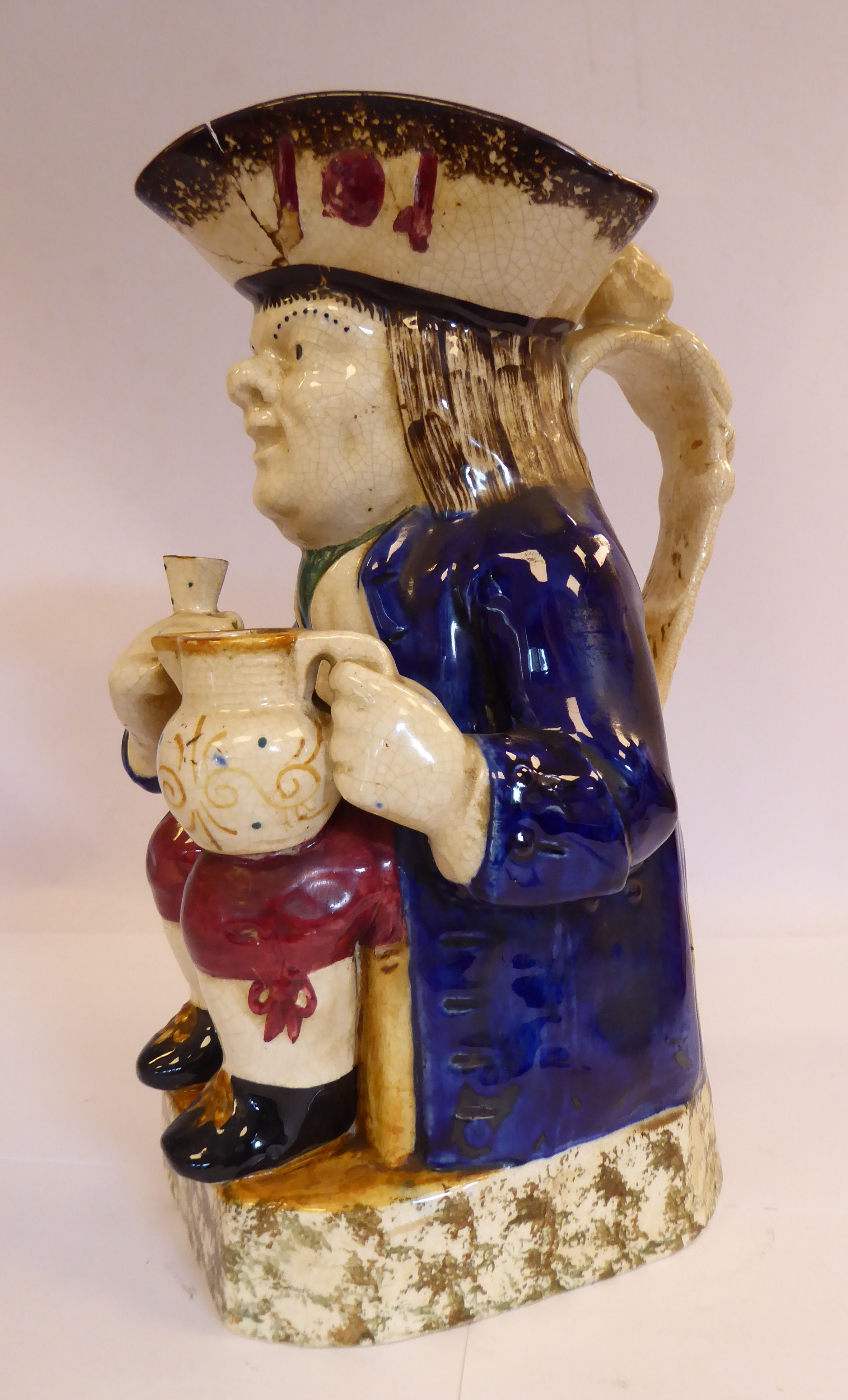 An early 19thC Staffordshire pottery Toby jug, the seated figure wearing a tricorn hat, - Image 2 of 7