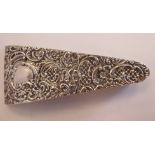 An Edwardian silver etui of tapered box design, allover embossed and chased with latticed, floral,