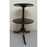 An early 19thC mahogany dumb waiter, the two tiers with reeded borders,