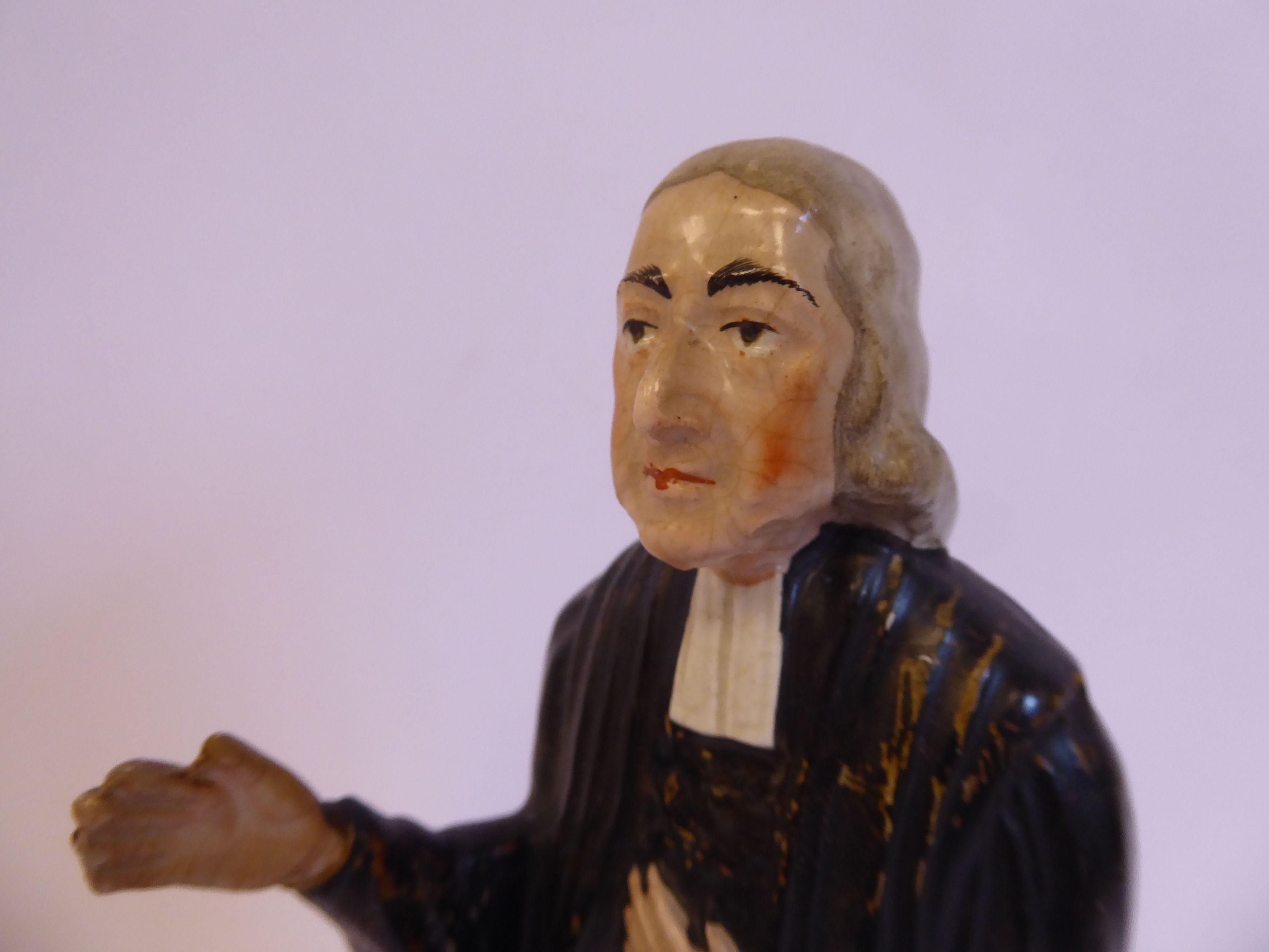 A 19thC Staffordshire pottery figure, John Wesley, wearing a black surplus and white cravat, - Image 5 of 5