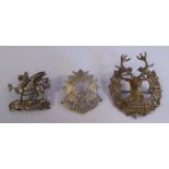 Three silver military cap badges, viz.