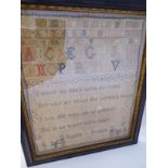 A sampler, worked in coloured silks, featuring the alphabet, Arabic numerals,