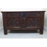 A mid 18thC oak chest with straight, panelled sides, moulded rails,