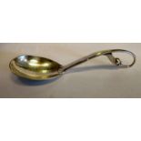 A Georg Jensen silver sauce ladle with a scrolled leaf and berry terminal bears an import mark