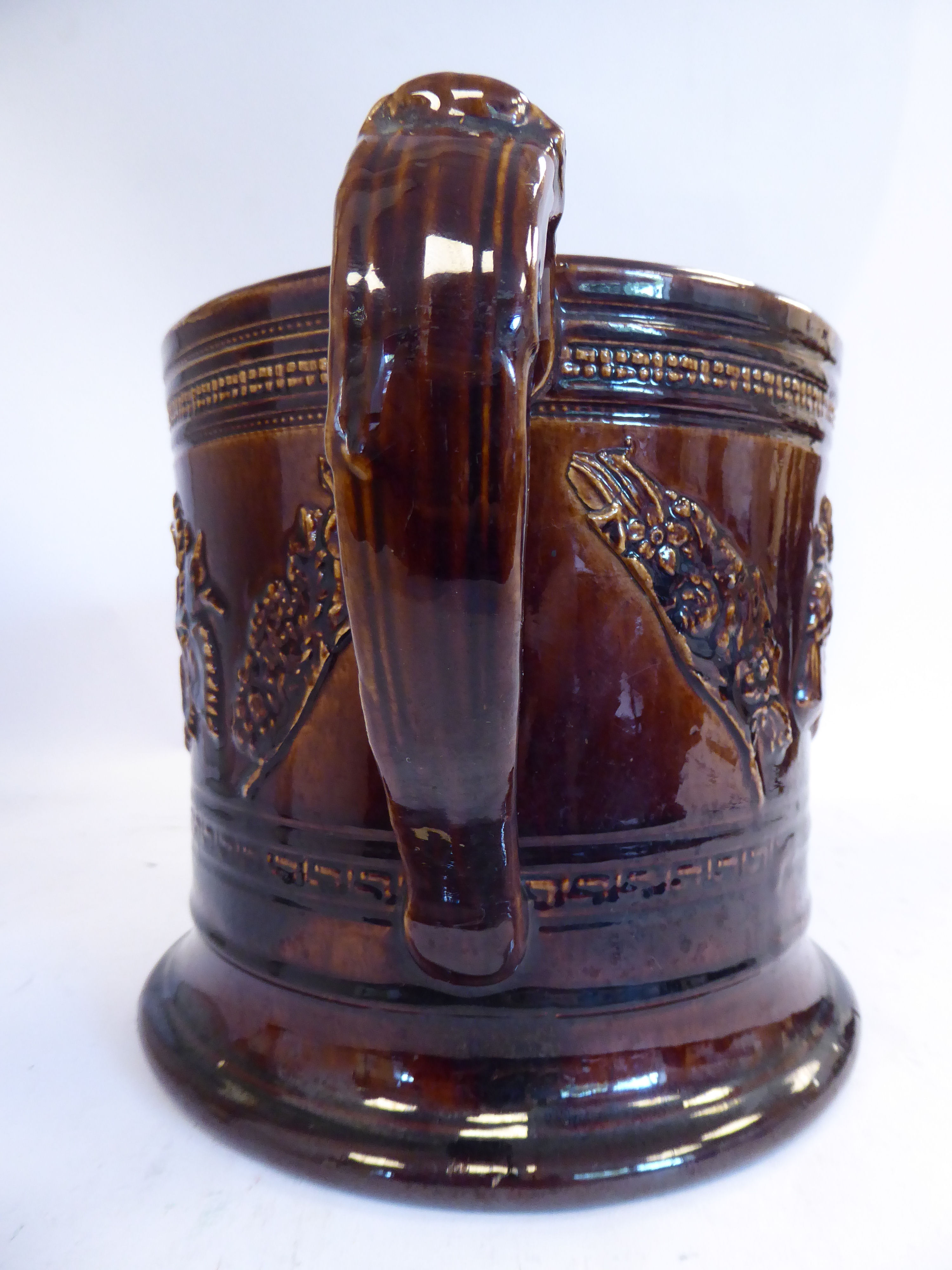 A mid 19thC treacle glazed earthenware 'oversize' loving cup with straight sides, - Image 4 of 7