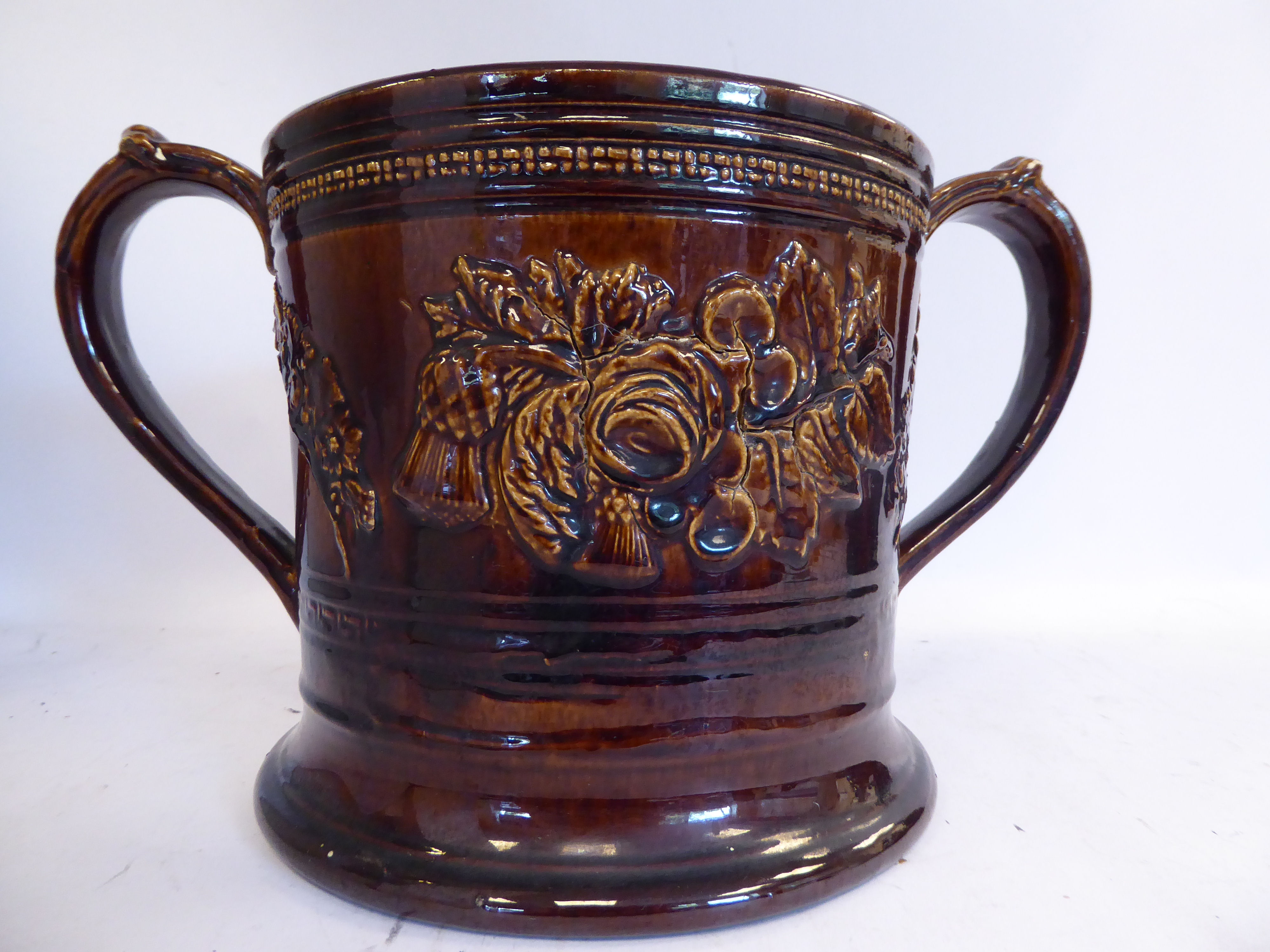 A mid 19thC treacle glazed earthenware 'oversize' loving cup with straight sides, - Image 5 of 7