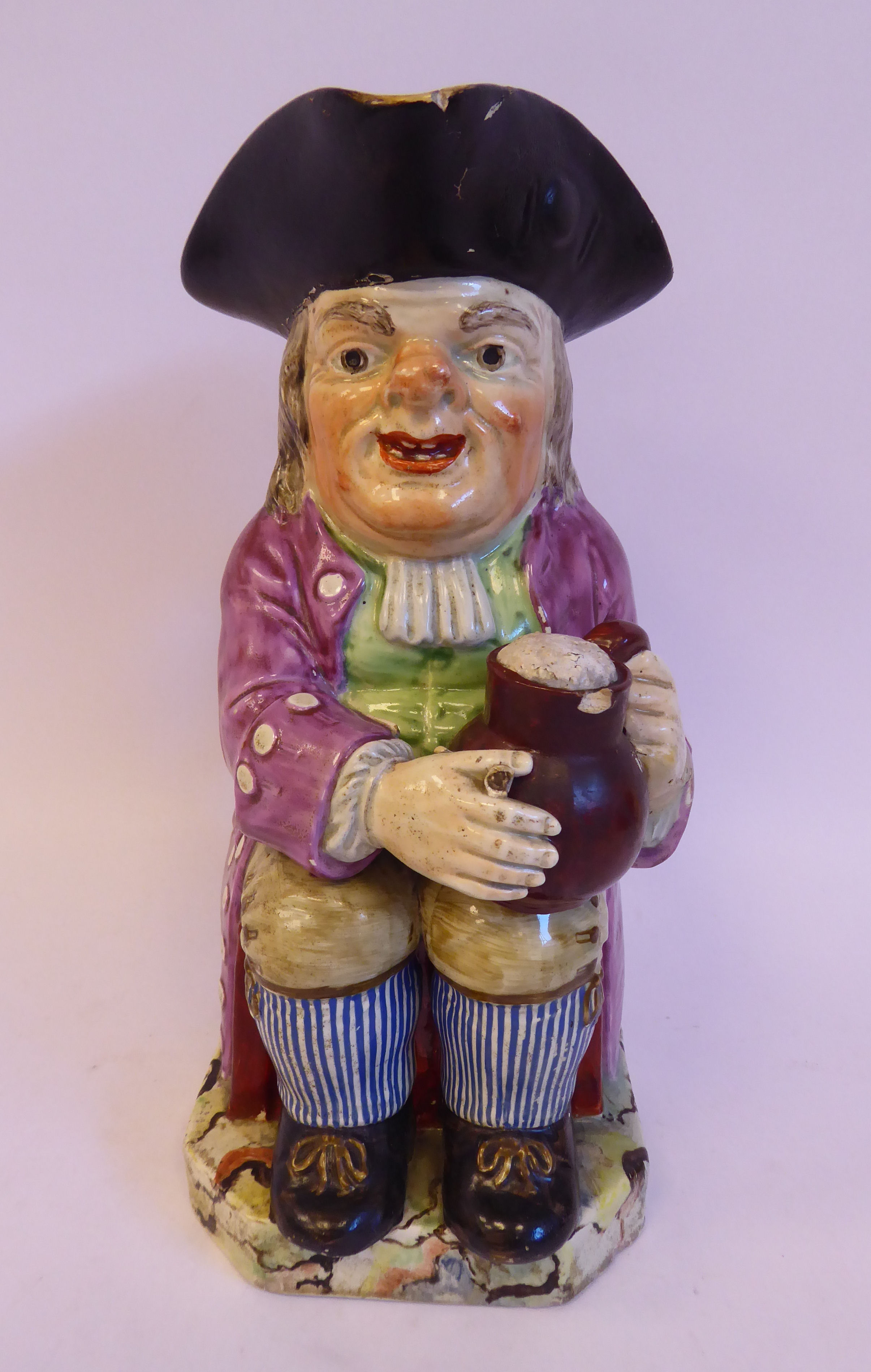 A late 18th/early 19thC Staffordshire pottery Toby jug,