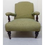 A late Victorian library chair with low, level, open arms, upholstered in oatmeal coloured fabric,