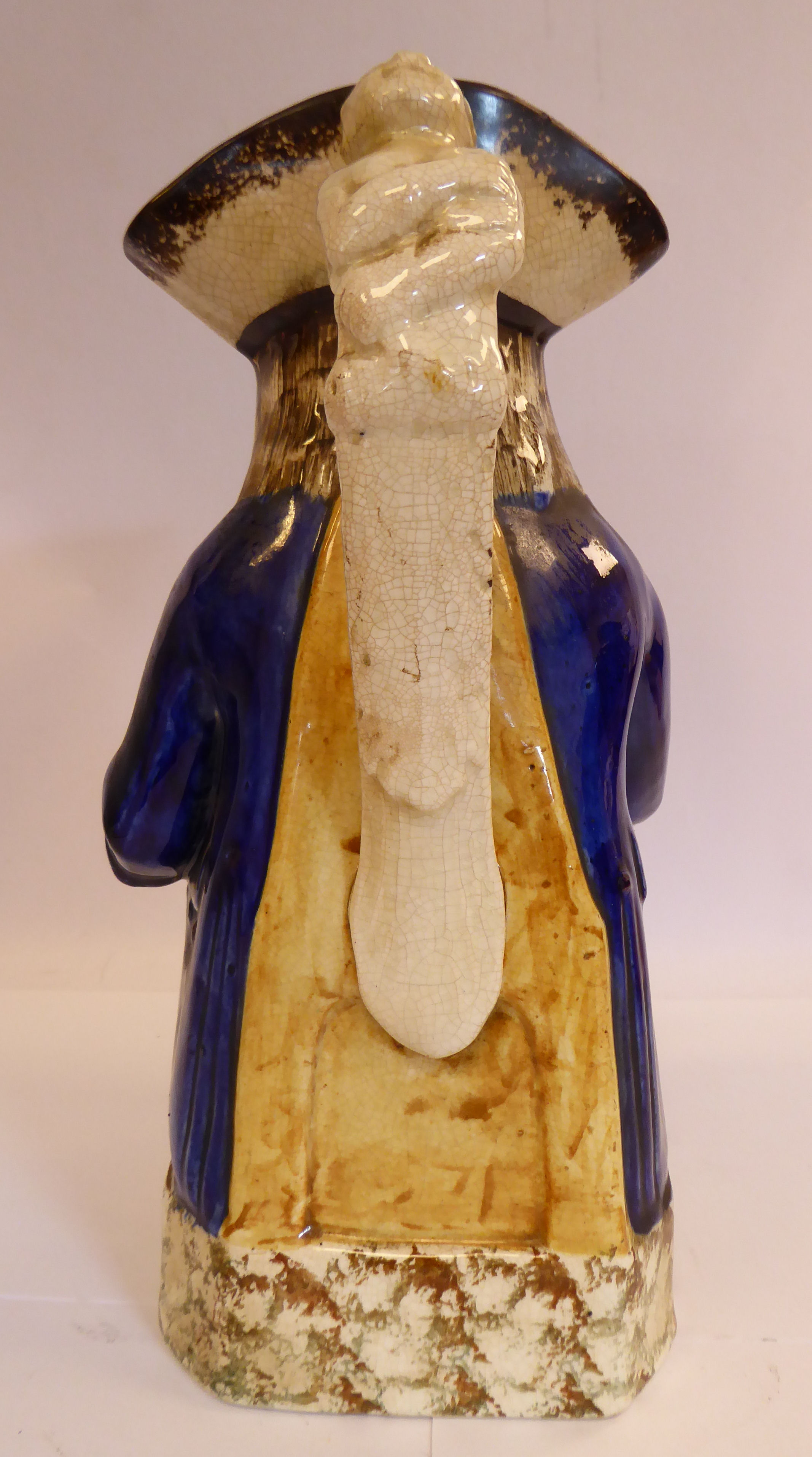 An early 19thC Staffordshire pottery Toby jug, the seated figure wearing a tricorn hat, - Image 3 of 7