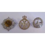 Three silver military cap badges, viz.