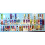 Approximately forty-five police and other enforcement associated medals, many on ribbons,