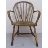 An early 19thC bleached beech, oak and elm framed Windsor low hoop and stick back chair with open,