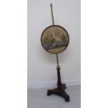 A late Regency rosewood and lacquered brass polescreen, featuring an embroidered study of wildfowl,