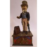 A late 19thC Uncle Sam painted cast iron novelty, mechanical money bank,