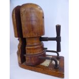 A late 19th/early 20thC milliner's adjustable two part wooden hat block,