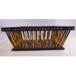 A late 19thC ivory inlaid ebonised wood and porcupine quill rectangular basket with angled sides