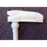 An early 20thC carved ivory walking cane, the naturalistically knotted,