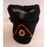 A World War II German Army black side cap with a cloth eagle,