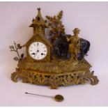 A late 19thC French gilt metal cased mantel clock, featuring a small dovecot,