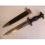 A replica SS dagger, the white metal, mounted oak leaf and acorn carved,
