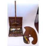 A late Victorian artist's mahogany paint box with straight sides, a folding flap on the hinged lid,